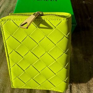 Brand New. Bottega Veneta electric green wallet with gold zipper.